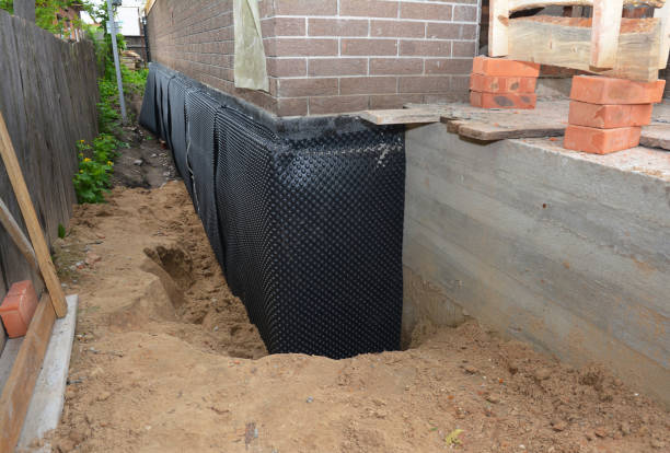 Happy homeowners after waterproofing job in Jeffersonton